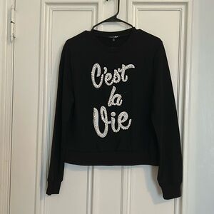 Black sweater shirt with “C’est la vie” embroidered